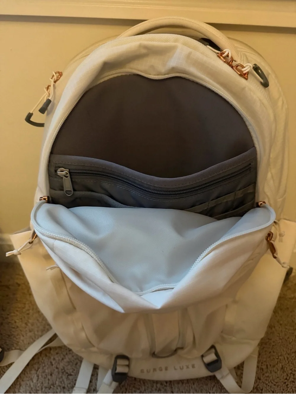 The North Face Surge Lux Backpack in Cream with Rose Gold(good as new 90%)